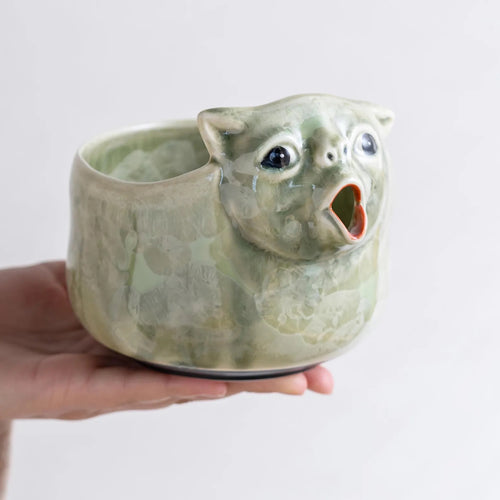 Celadon Green crystal glaze cat matcha bowl held in hand